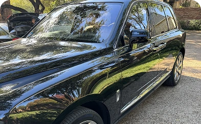 Car detailing experts cleaning vehicle interior